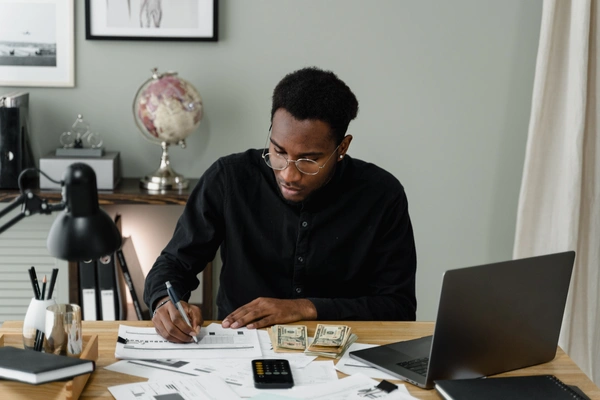 Accountant balances checkbook
